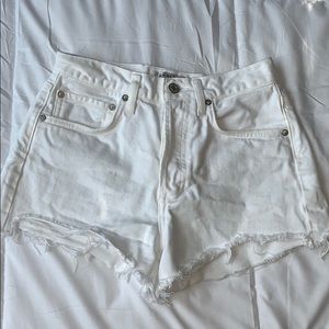 Lightly distressed white denim shorts